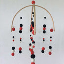 crib mobile black red white