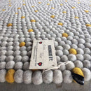 golden felt ball rug