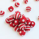 white on red polka dot swirl felt balls