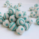 mint on white polka dot swirl felt balls